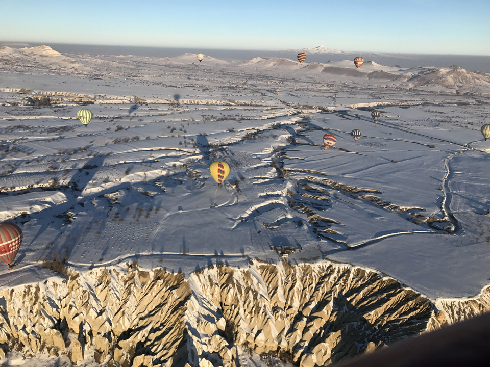 Aerial view of hot air balloons over Cappadocia.