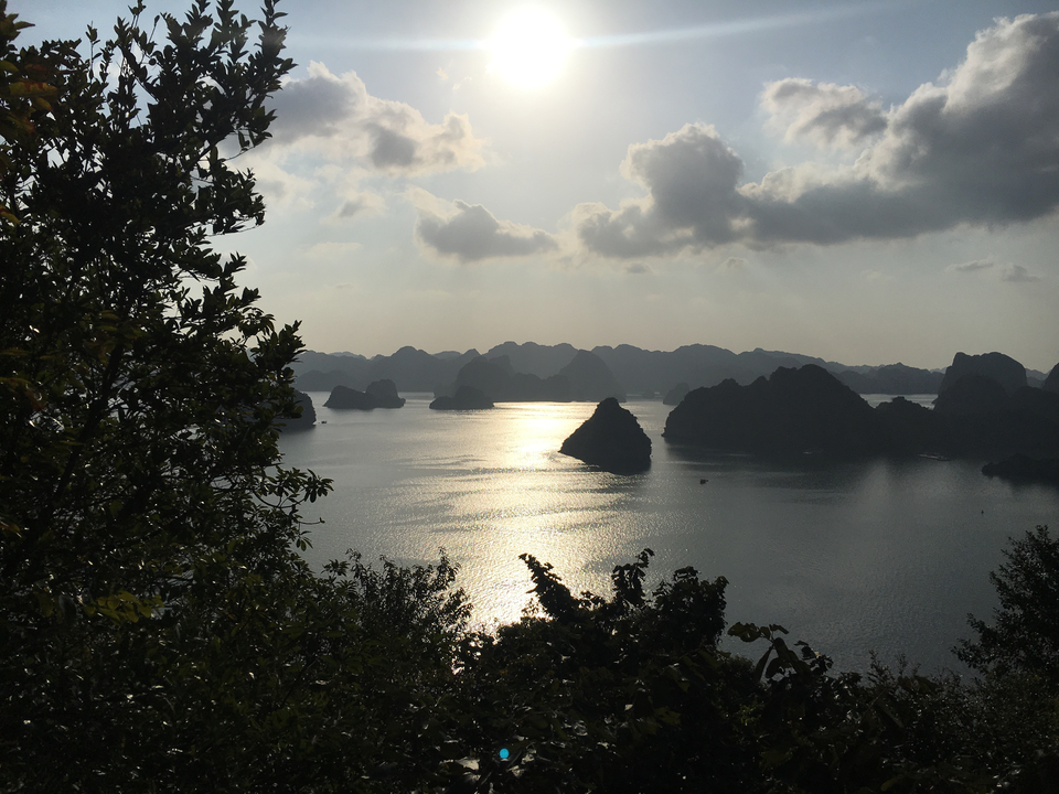 Sunlight reflecting on water surrounded by islands.