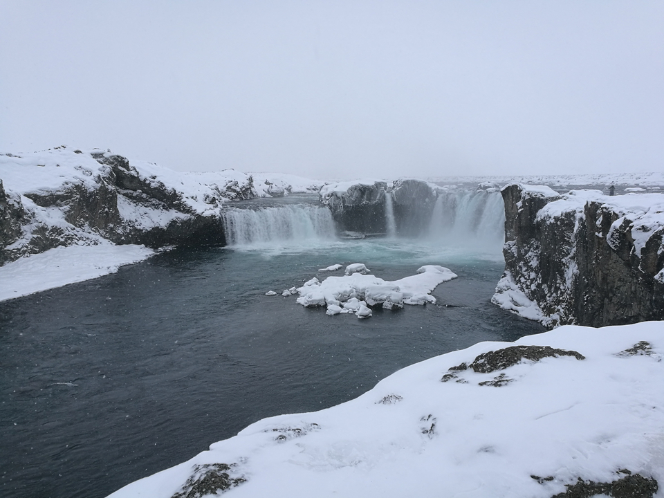 Frozen waterfall in a snowy landscape