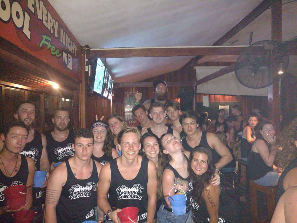 Large group of people enjoying a party at night.