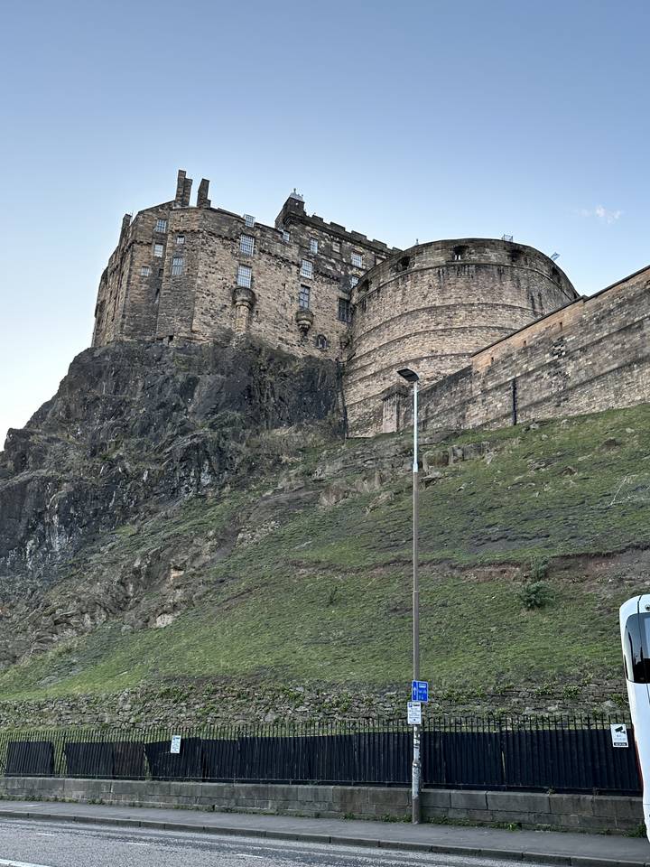 A historic castle built on a rocky hill.