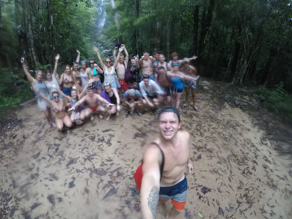Blurry group photo in a forest area.