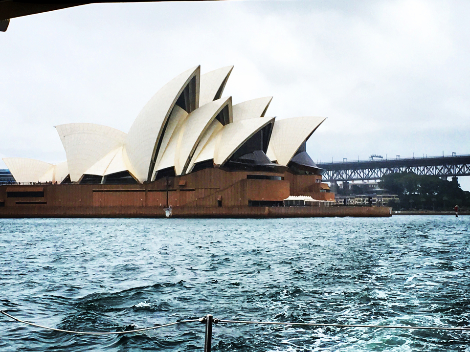 Close-up of the Sydney Opera House with Sydney Harbour Bridge.