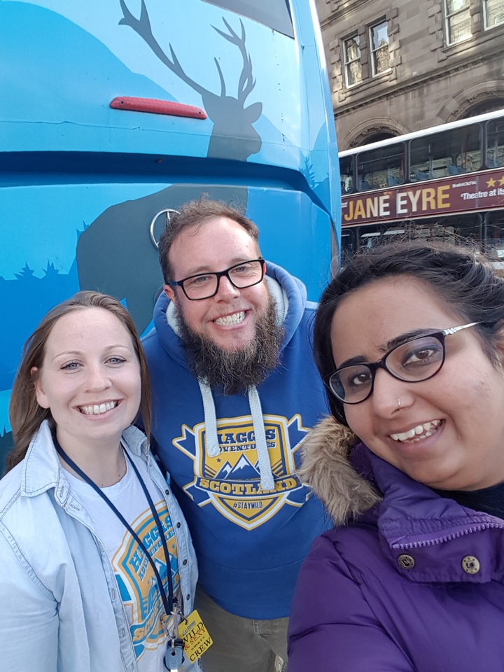 Three people smiling and posing for a selfie.
