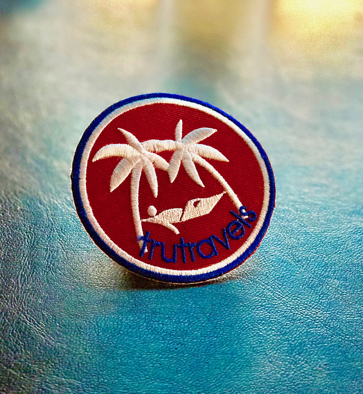 Fabric patch with tropical logo.