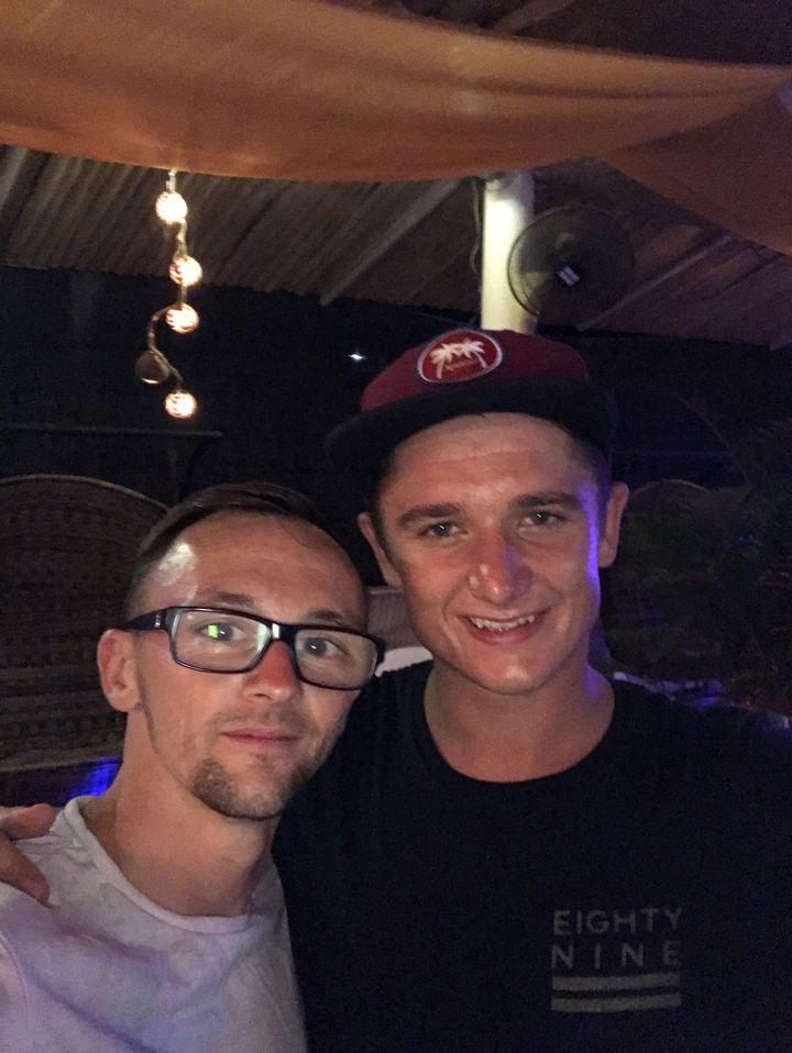 Two men posing for a photo, smiling.