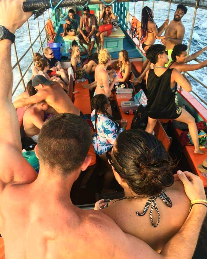 Lively group of people on a party boat.
