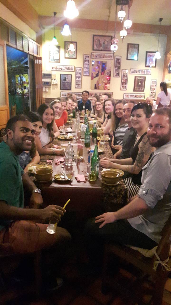 Group of people at a restaurant table.