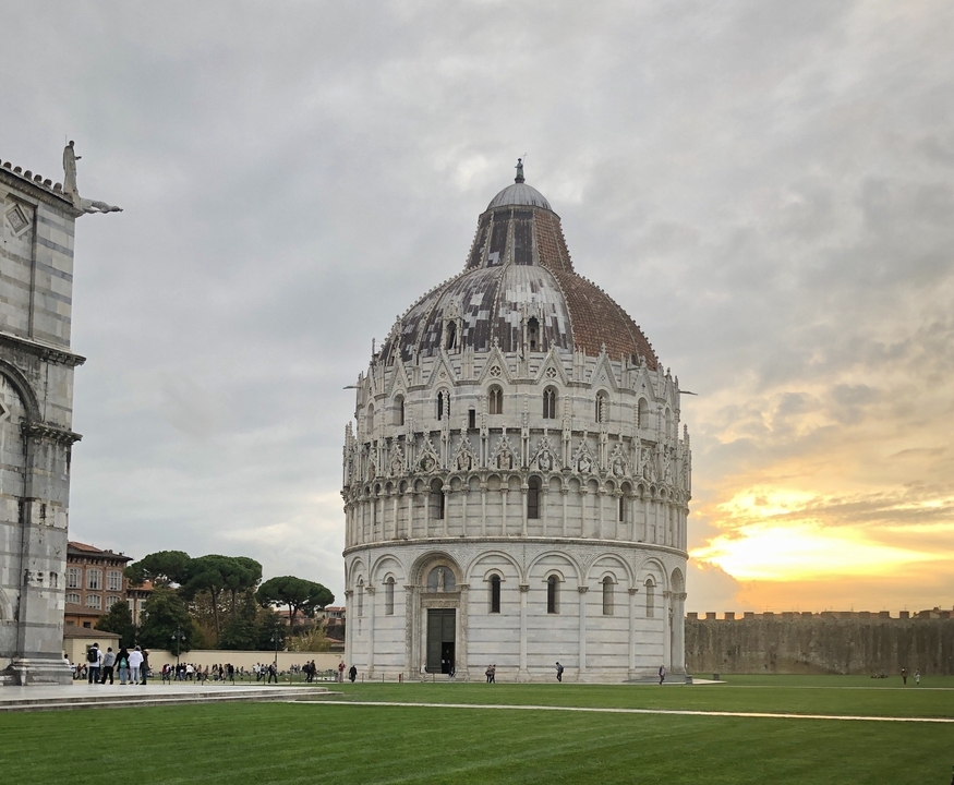 White structure with detailed architecture against a sunset.