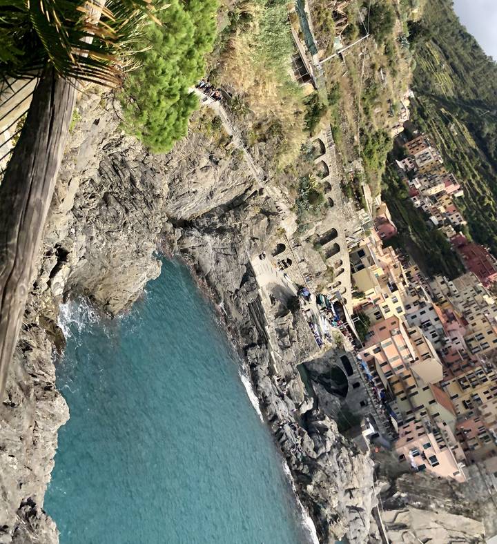 Rocky coastline with stone arches and the sea.