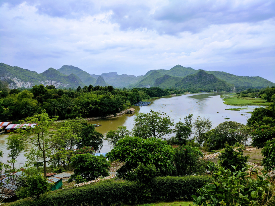 Scenic river and mountain landscape in a rural setting.
