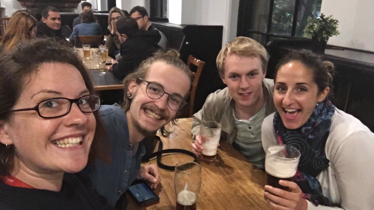 Group of people enjoying drinks at a bar.