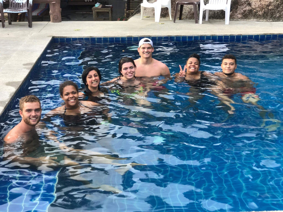 People enjoying a swim in a pool.
