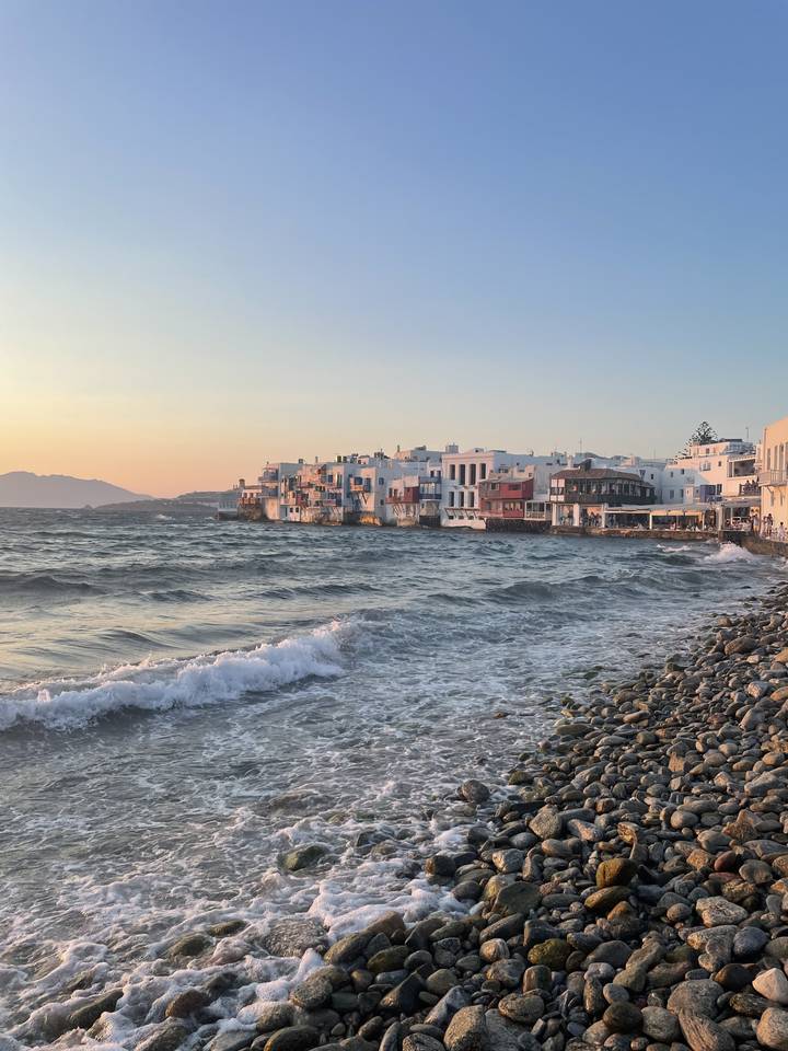 Coastal view of buildings and rocky shoreline