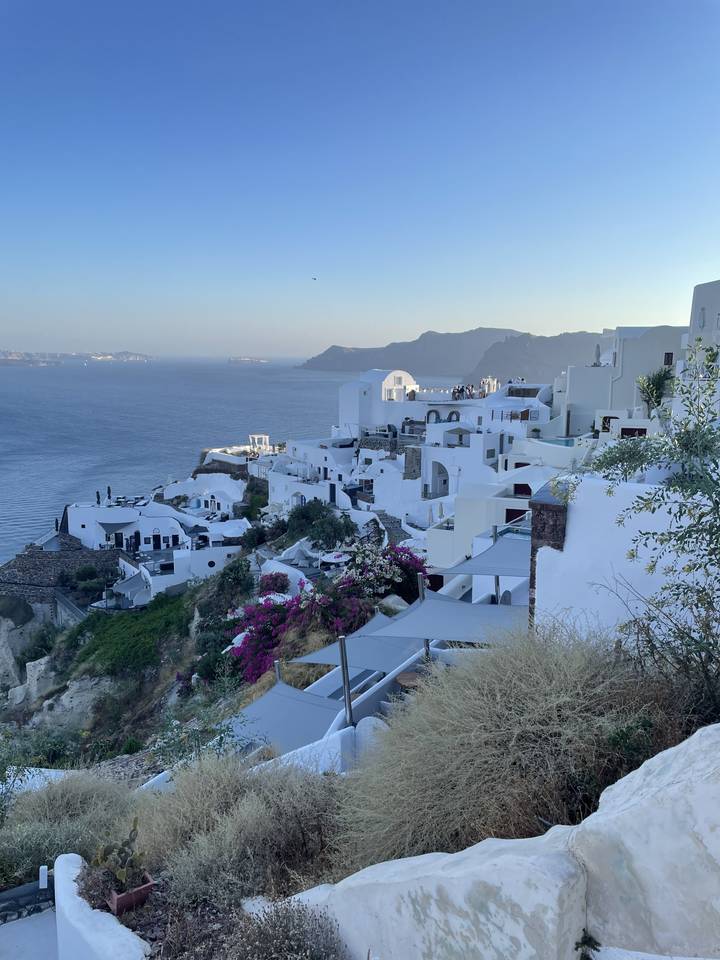 Scenic coastal view with white buildings and mountains