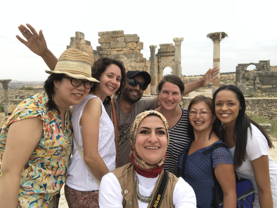 Group selfie at ancient ruins with columns.