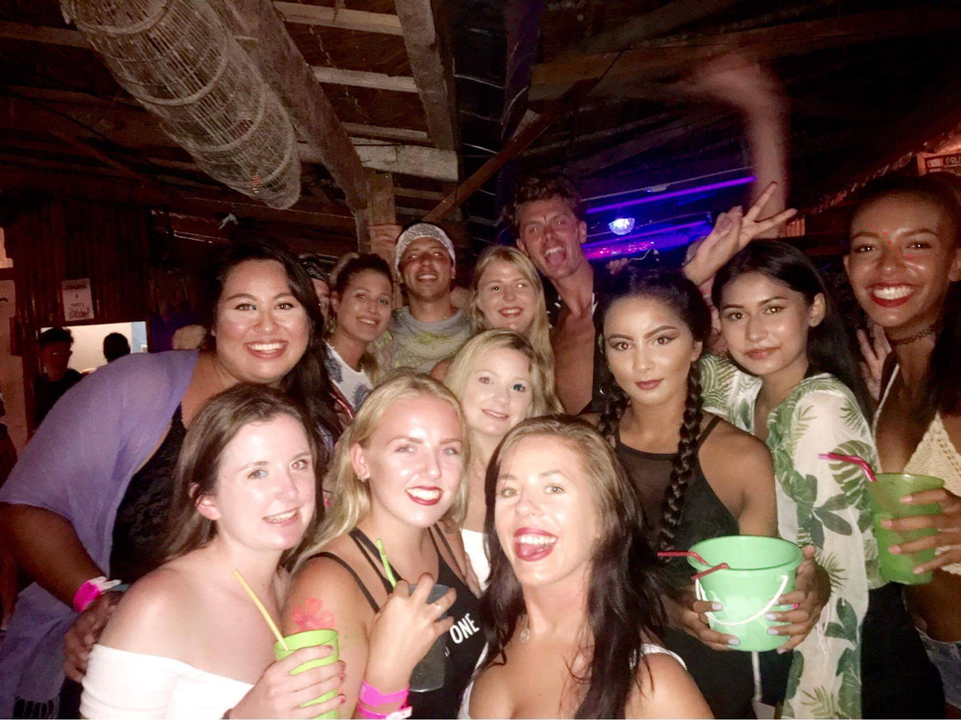 Group photo at a vibrant nightlife event.