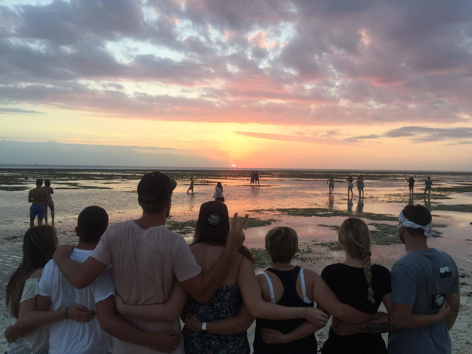 People watching the sunset at the beach.