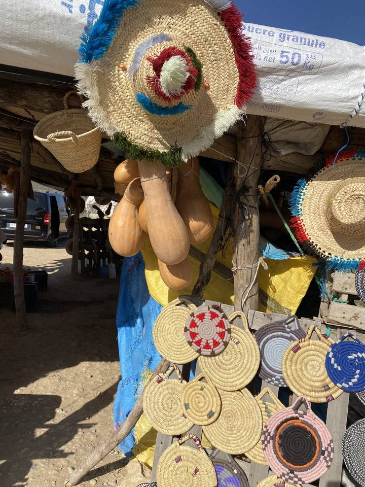 Handmade crafts with woven items on display.