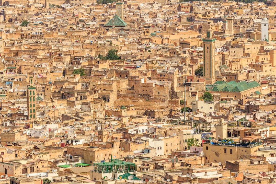 A densely packed view of a Moroccan city with various buildings.