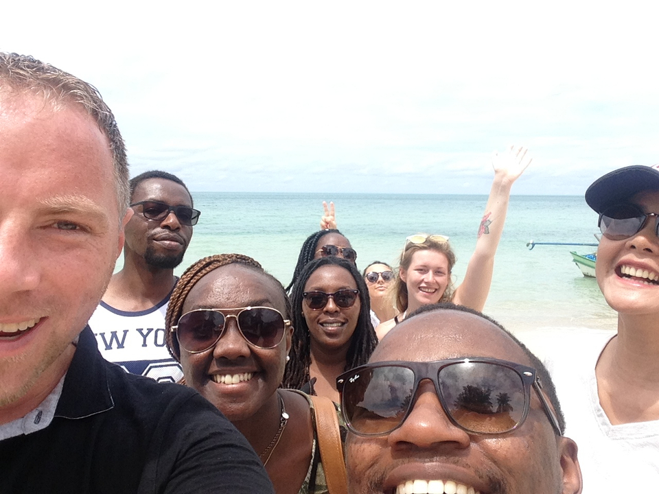 Group of friends enjoying at a seaside location.
