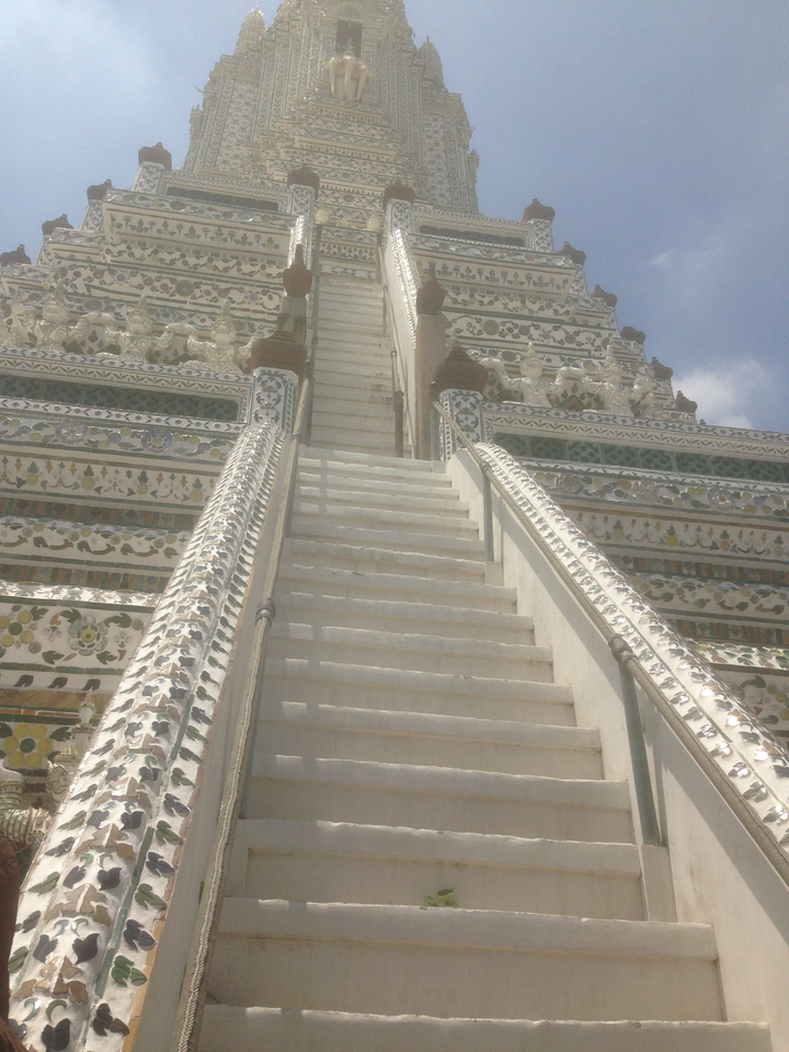 Staircase leading up a decorated temple structure.