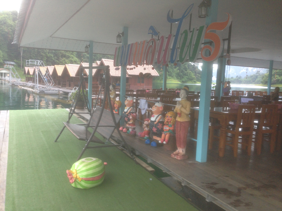 Floating restaurant with colorful decorations.