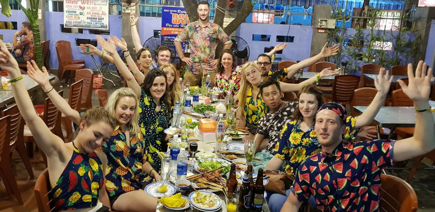 Group of people dining and celebrating.