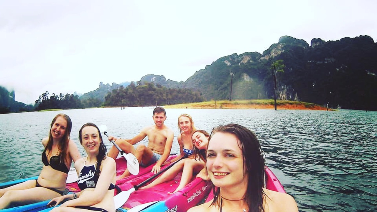 Group of people on kayaks in a lake.