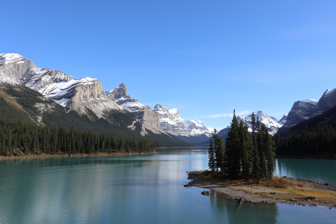 A picturesque view of mountains and a calm lake.