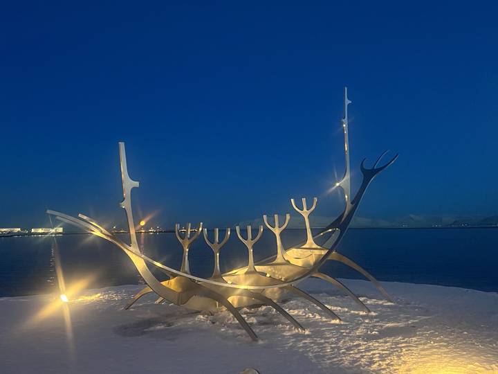 Artistic structure resembling a sculpture with reflective surfaces.