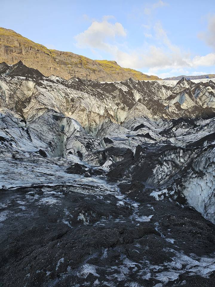 Snow-covered rocky landscape with glaciers.