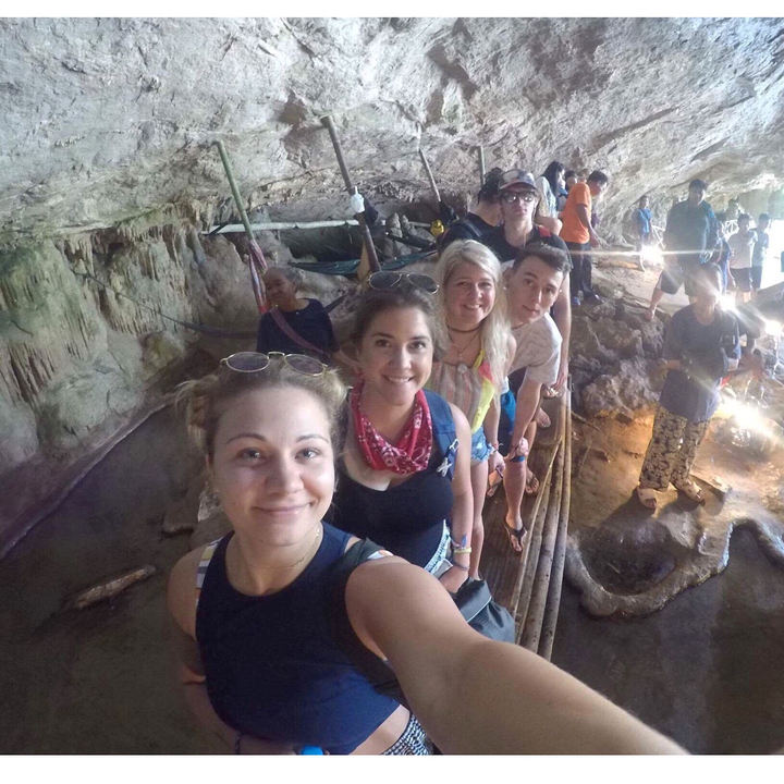 Group exploring an underground cave.