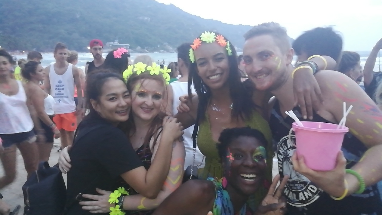 Group of friends at a party with neon body paint.