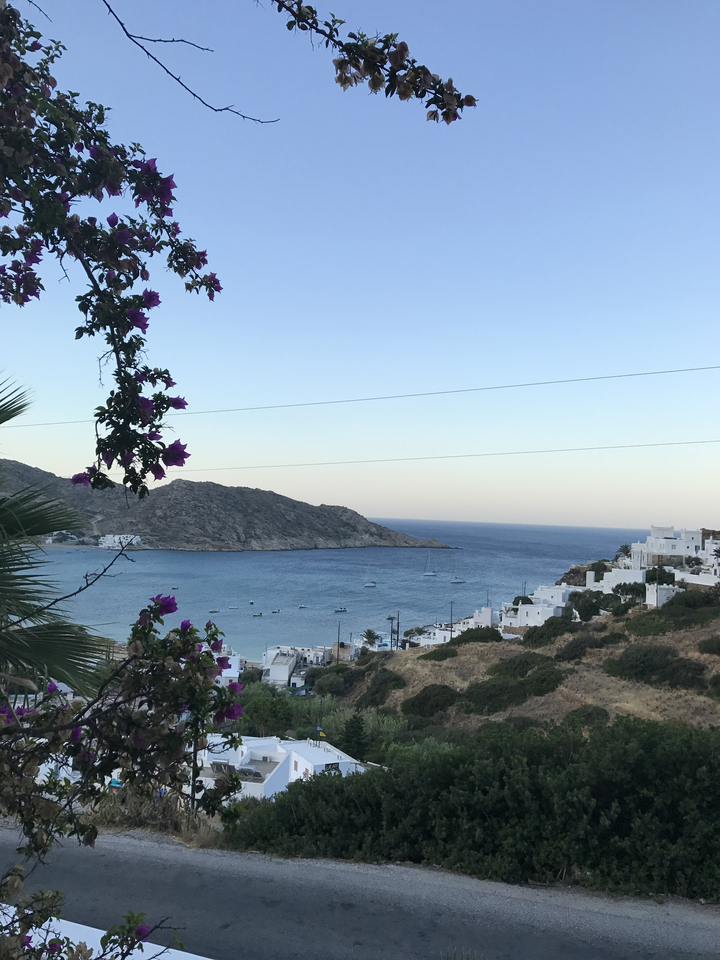 Coastal town with white buildings overlooking the sea.