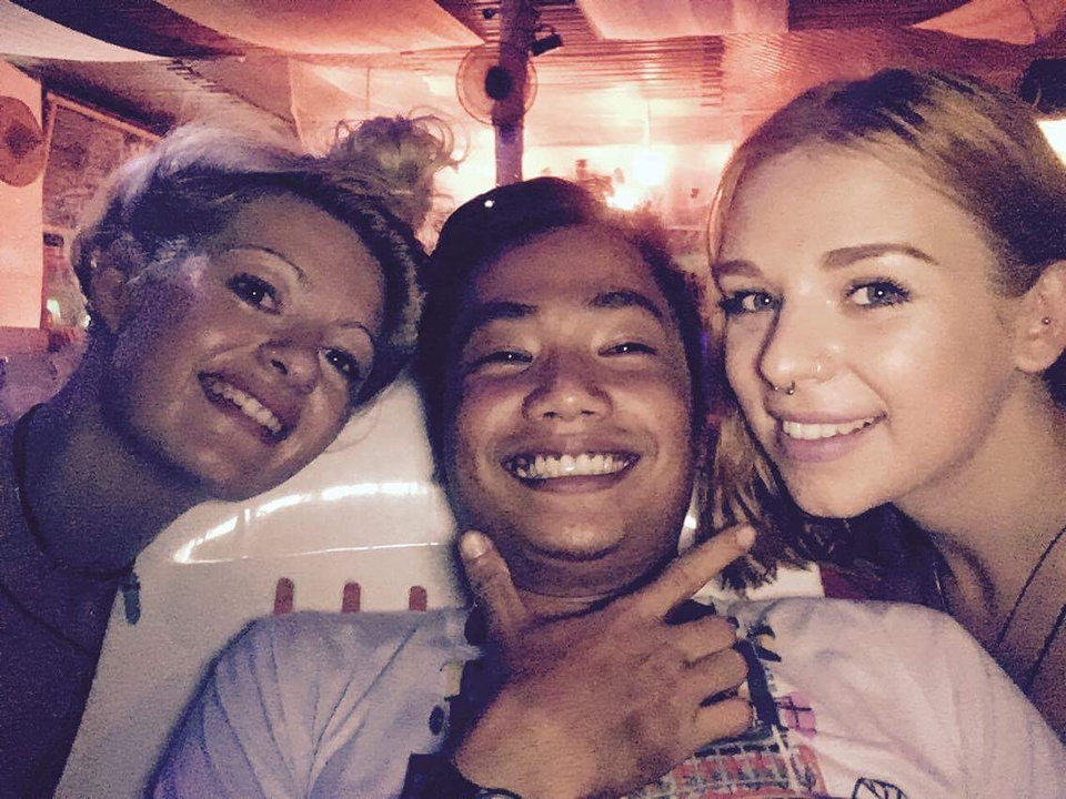 Close-up of people smiling in a party atmosphere.