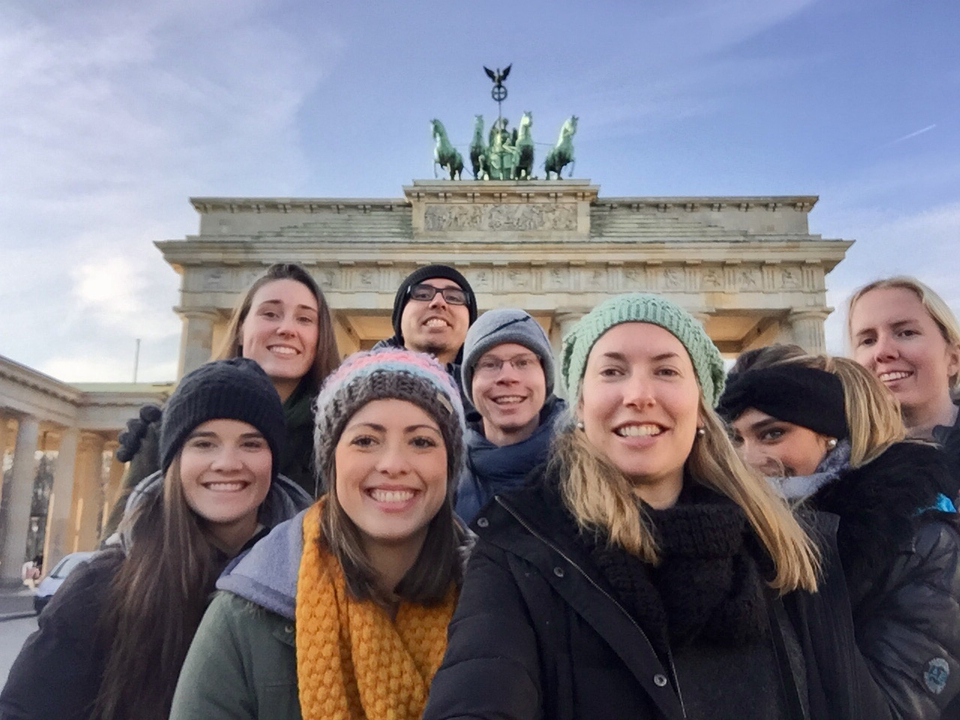 Group selfie in front of the Brandenburg Gate.