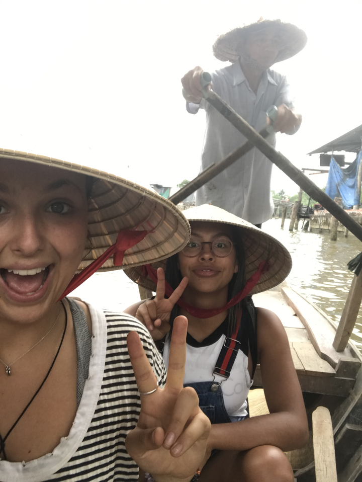 Two people on a boat, smiling for the camera.
