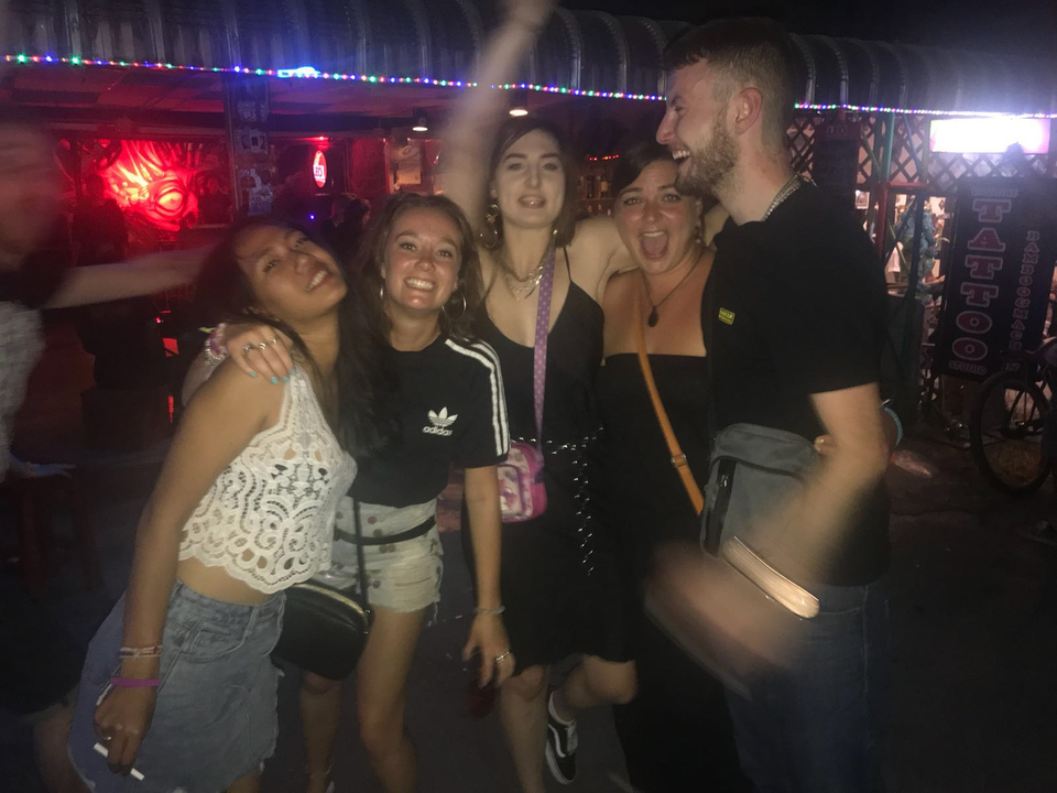 Friends enjoying a night out with lively atmosphere.