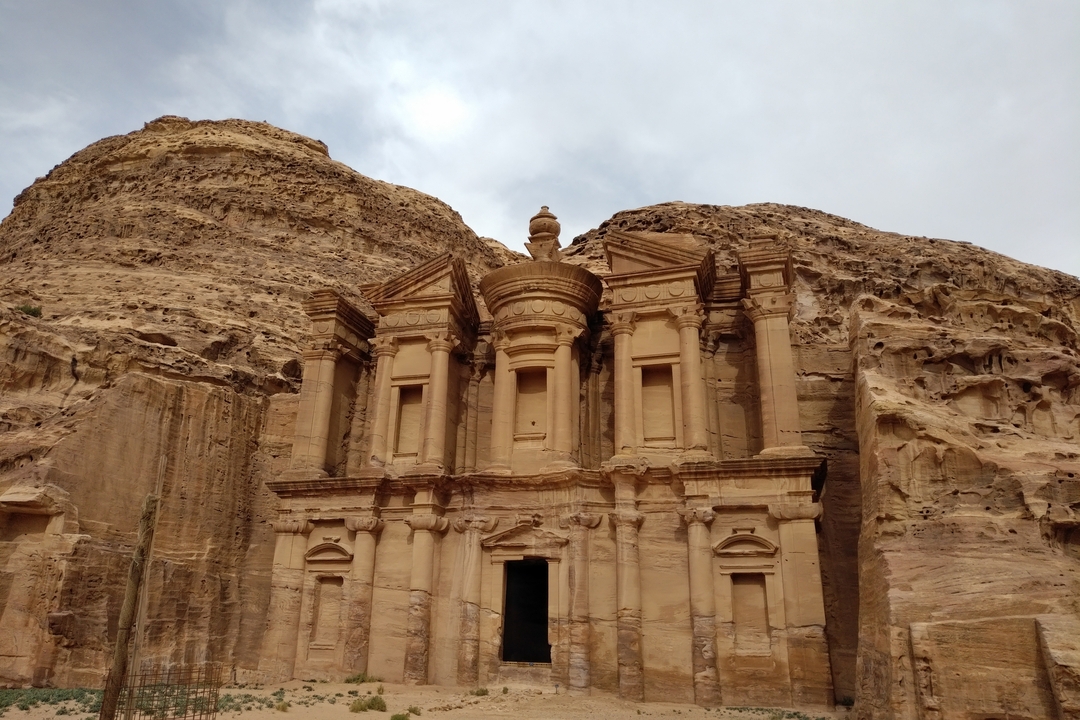 The Monastery at Petra carved into rose-red cliffs.