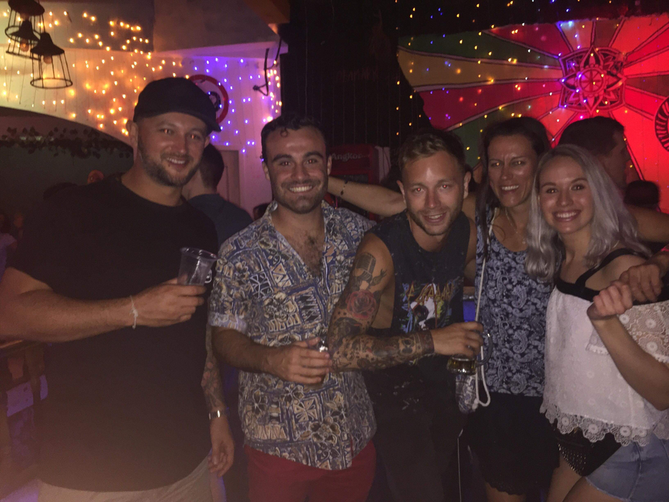 Group of friends enjoying night out at a vibrant venue.