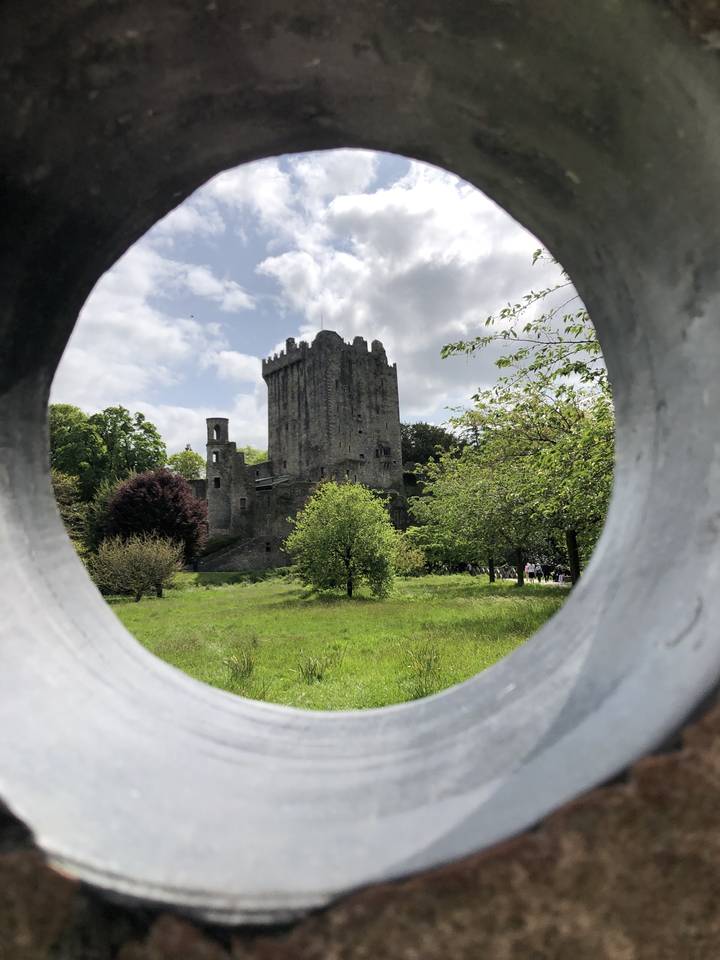 Stone castle viewed through a circular opening.