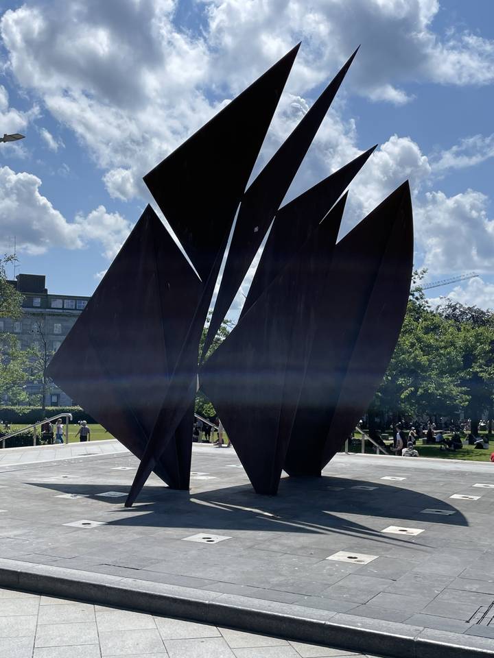 Abstract metal sculpture in an outdoor setting.