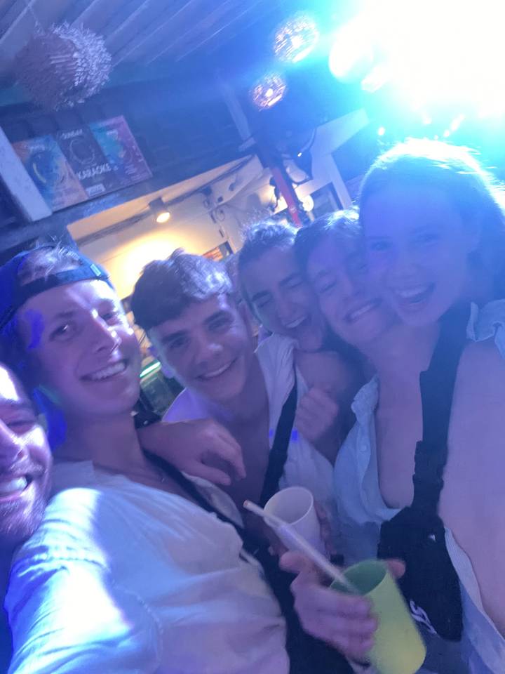 Group of people enjoying a night out in a club.
