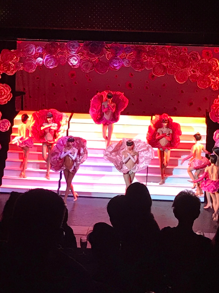 Theatrical performance with dancers and colorful costumes.