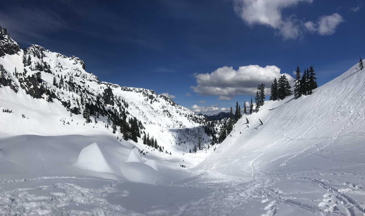 Snowy mountain landscape with clear blue skies.