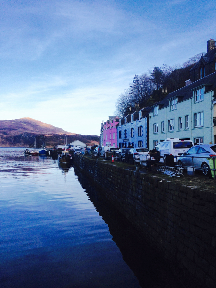 Row of colorful houses by the water.