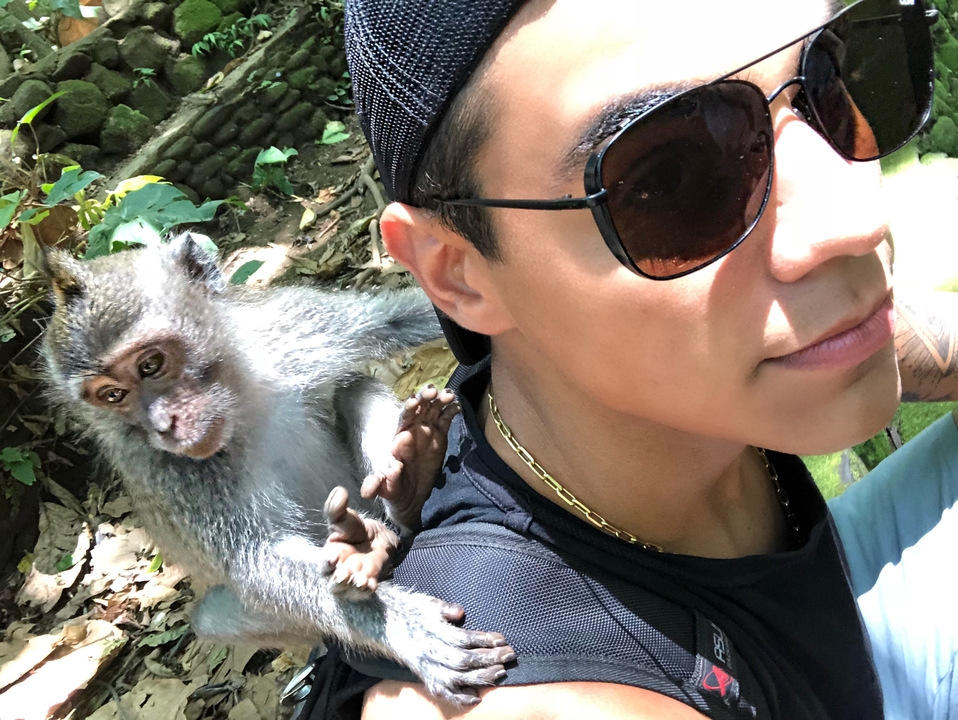 Person with a monkey on their shoulder.