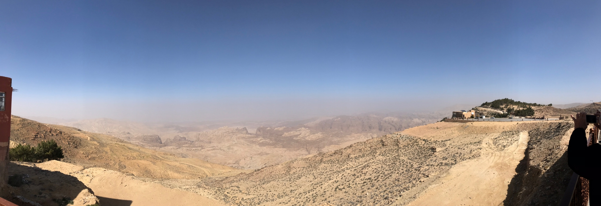 Panoramic view of a desert landscape with distant mountains.