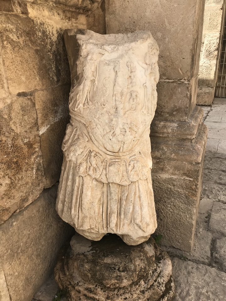 Carved stone base of a column.